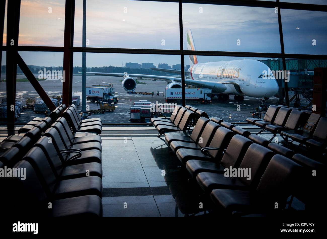 Sunrise at Beijing airport,waiting for the boarding call to the Emirates Airbus 380 that will take me to Dubai Stock Photo