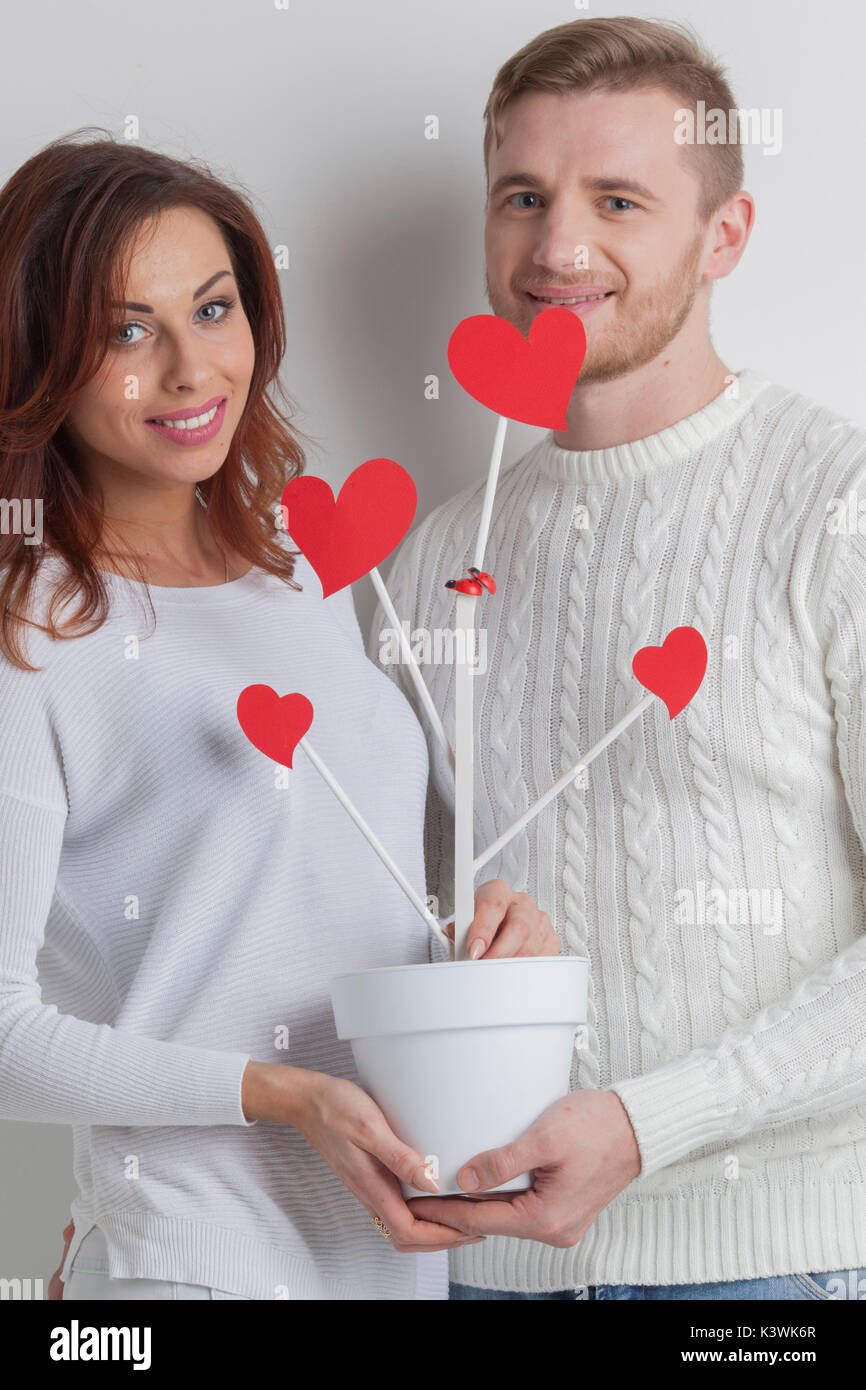 Happy couple growing tree of love, Valentines day wedding concept Stock ...