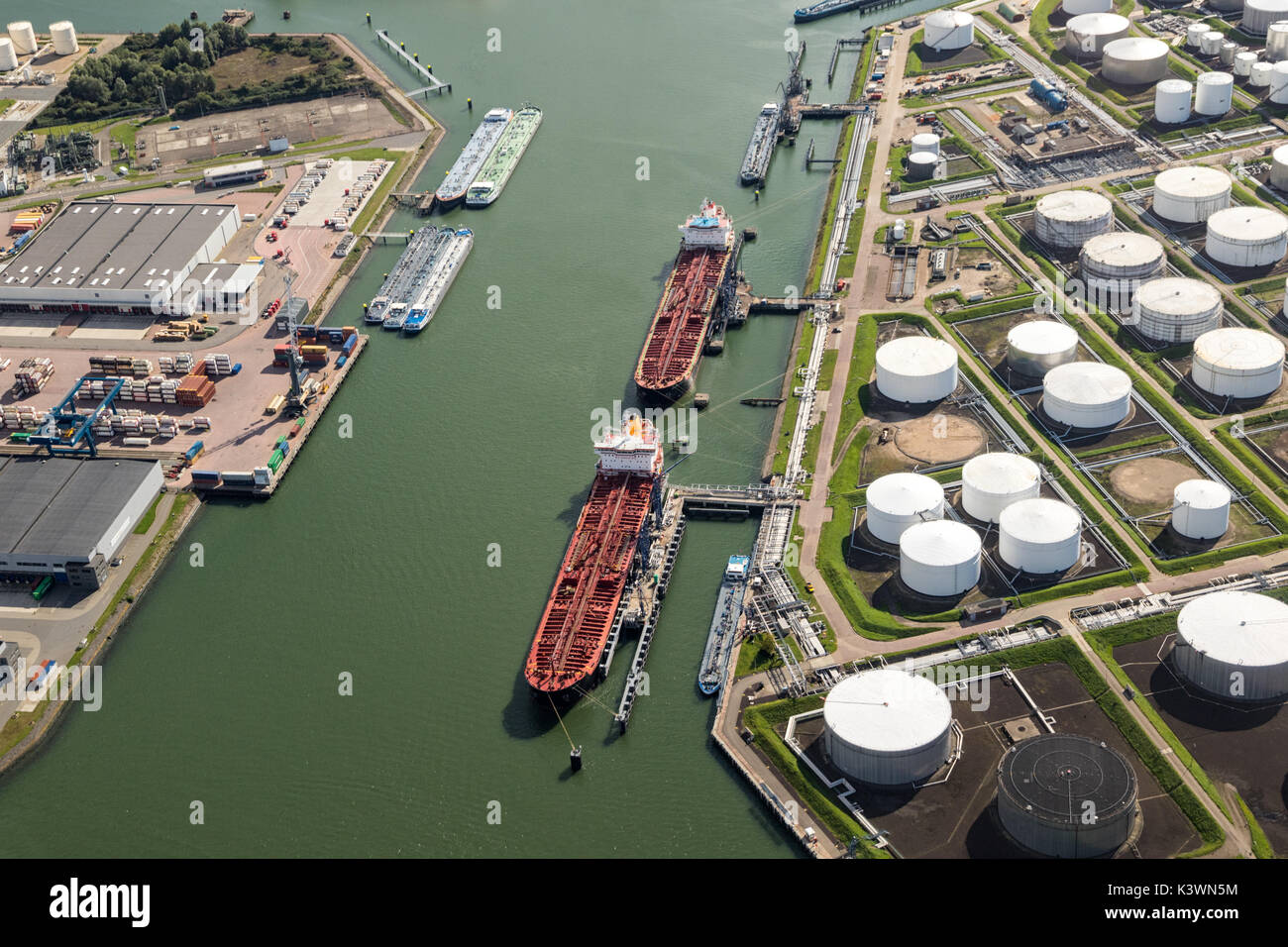 Aerial view of oil tankers moored at a oil storage terminal. Stock Photo