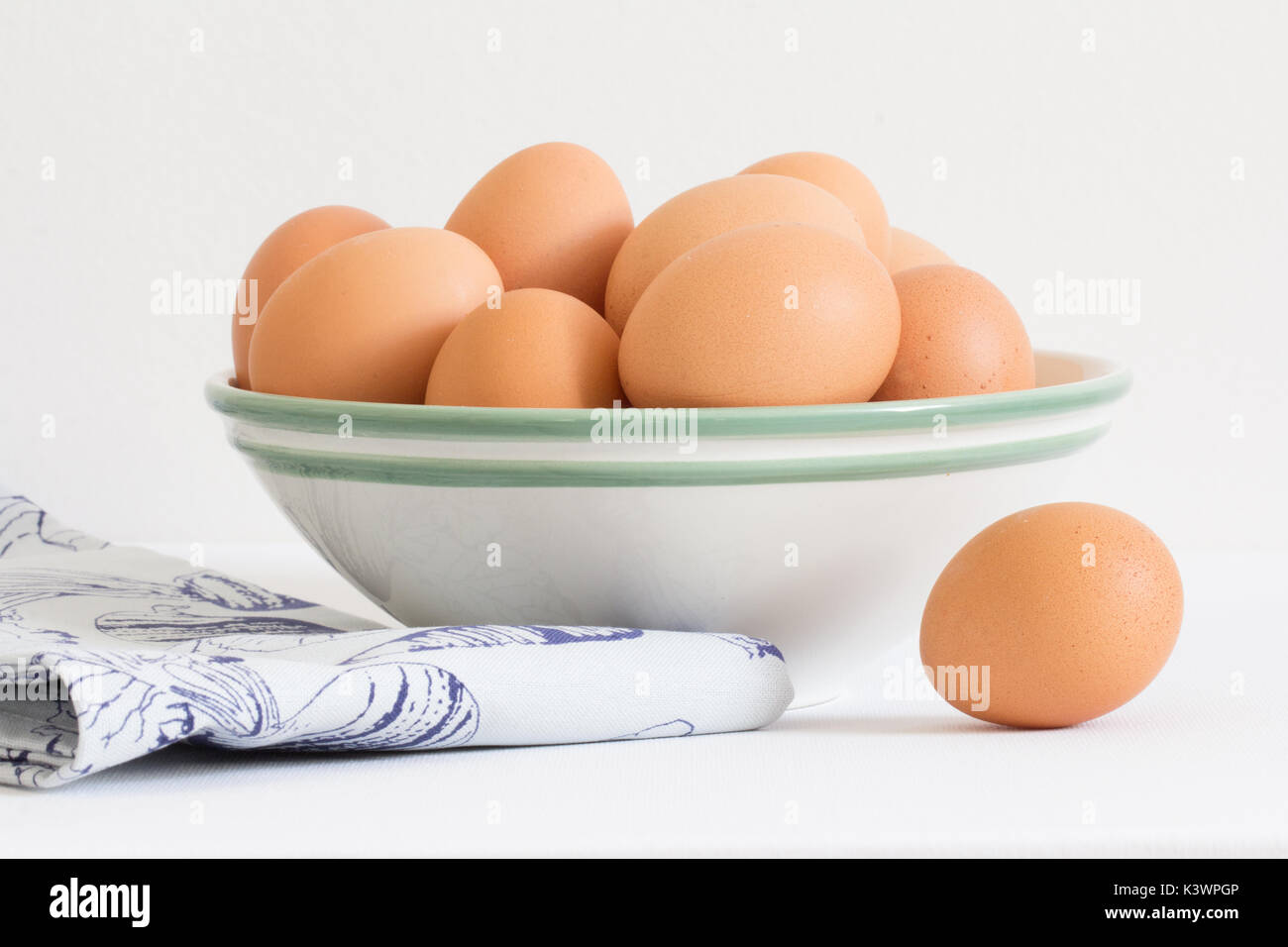 raw chicken eggs in white bowl Stock Photo