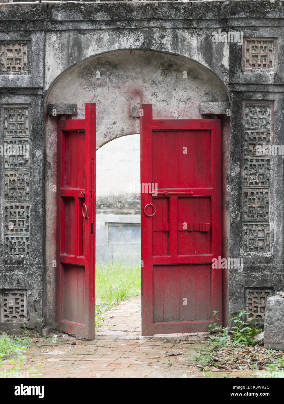 Old half opened red door Stock Photo
