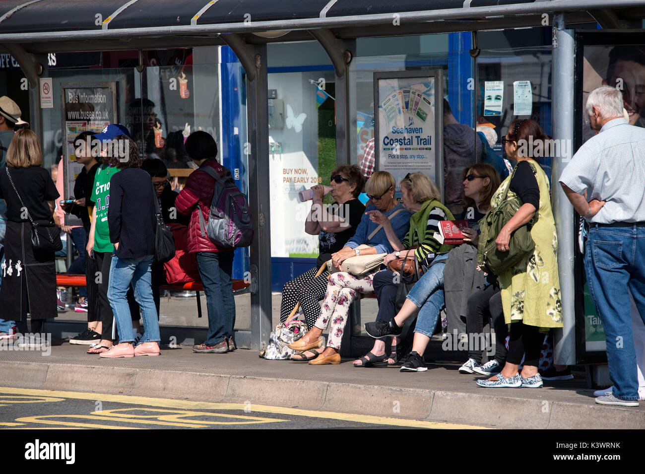Queue for a bus in Brighton city centre Stock Photo Alamy