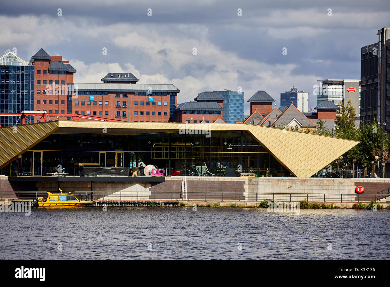 Regeneration docks area MediaCityUk at Salford Quays Gtr Manchester, gold modern architecture The Alchemist Bar & Restaurant  by Living Ventures Stock Photo