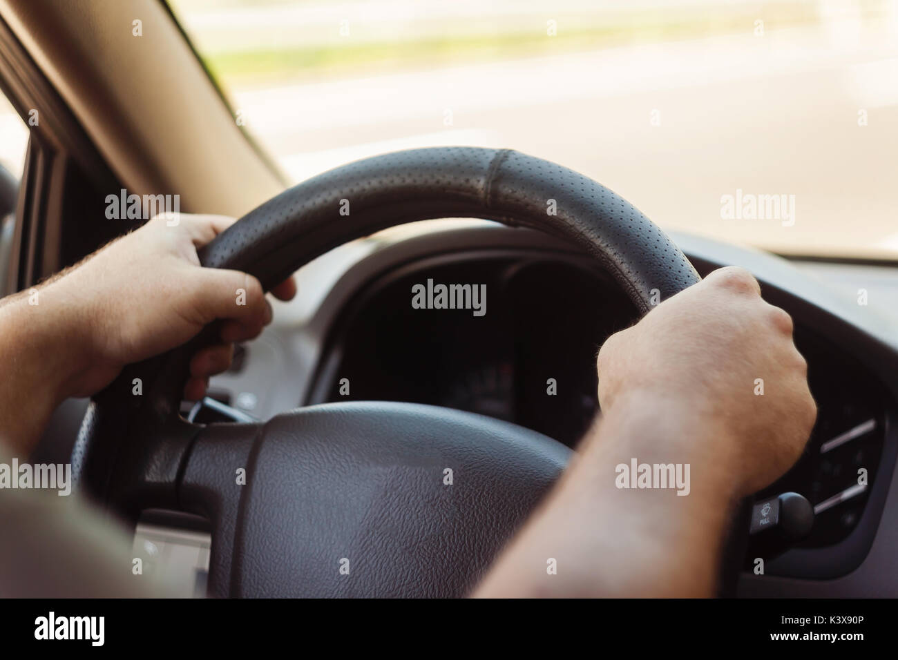 Mans hands on steering driving hi-res stock photography and images - Alamy