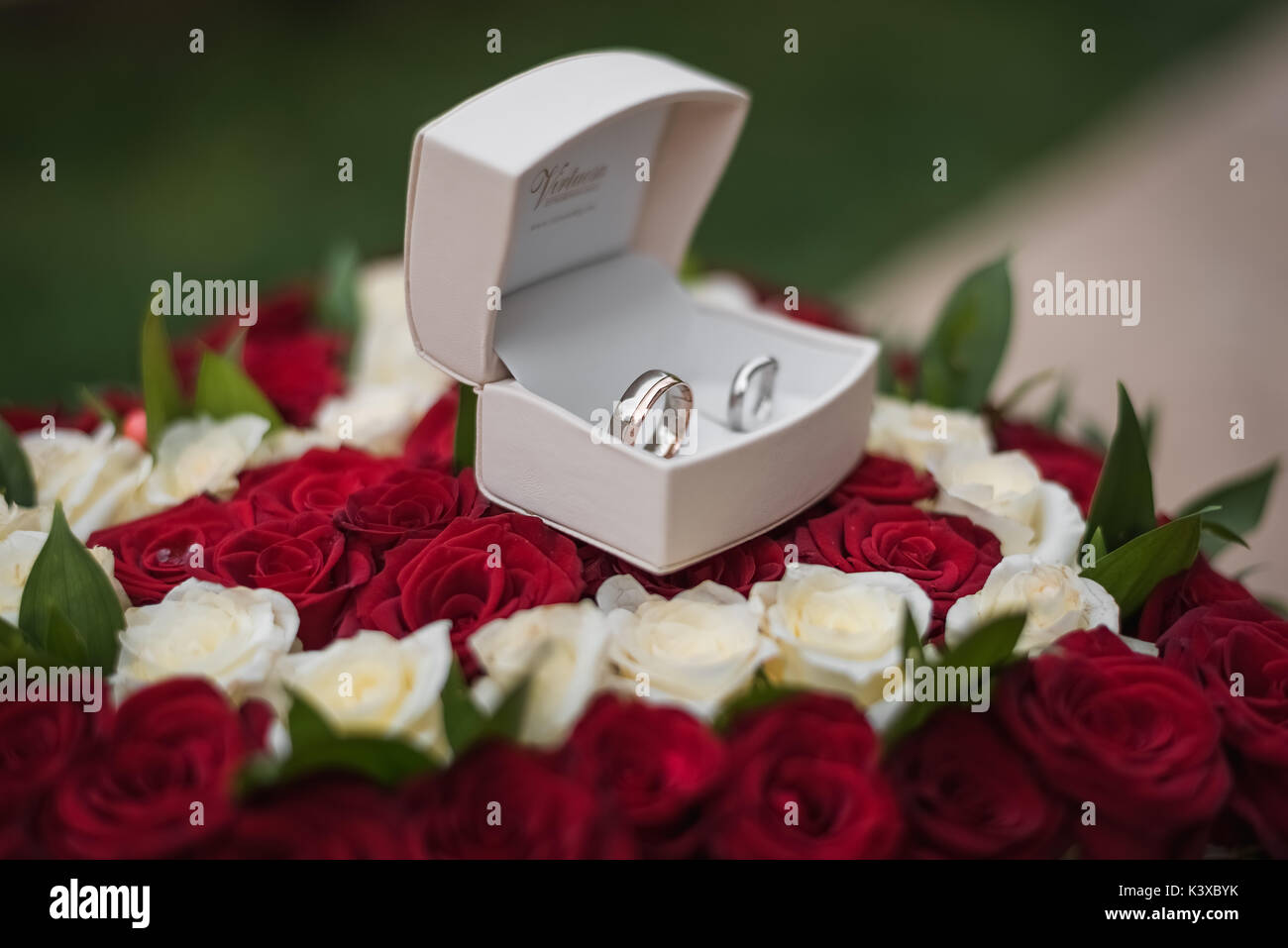 wedding rings in heart of roses Stock Photo