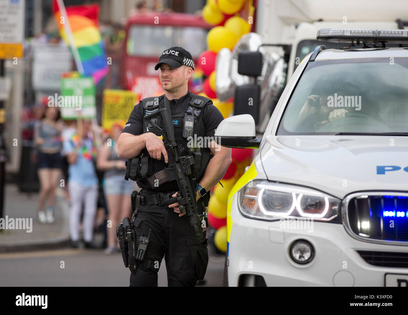 An armed police officer in Birmingham city centre during Pride celebrations. Stock Photo
