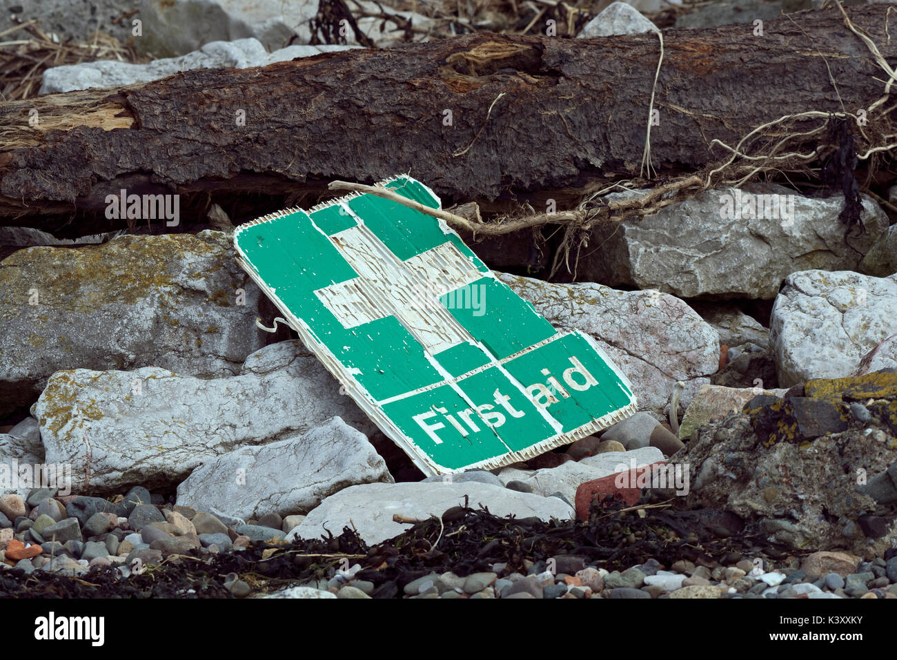 Plastic first aid sign washed up on beach in Lancashire Stock Photo