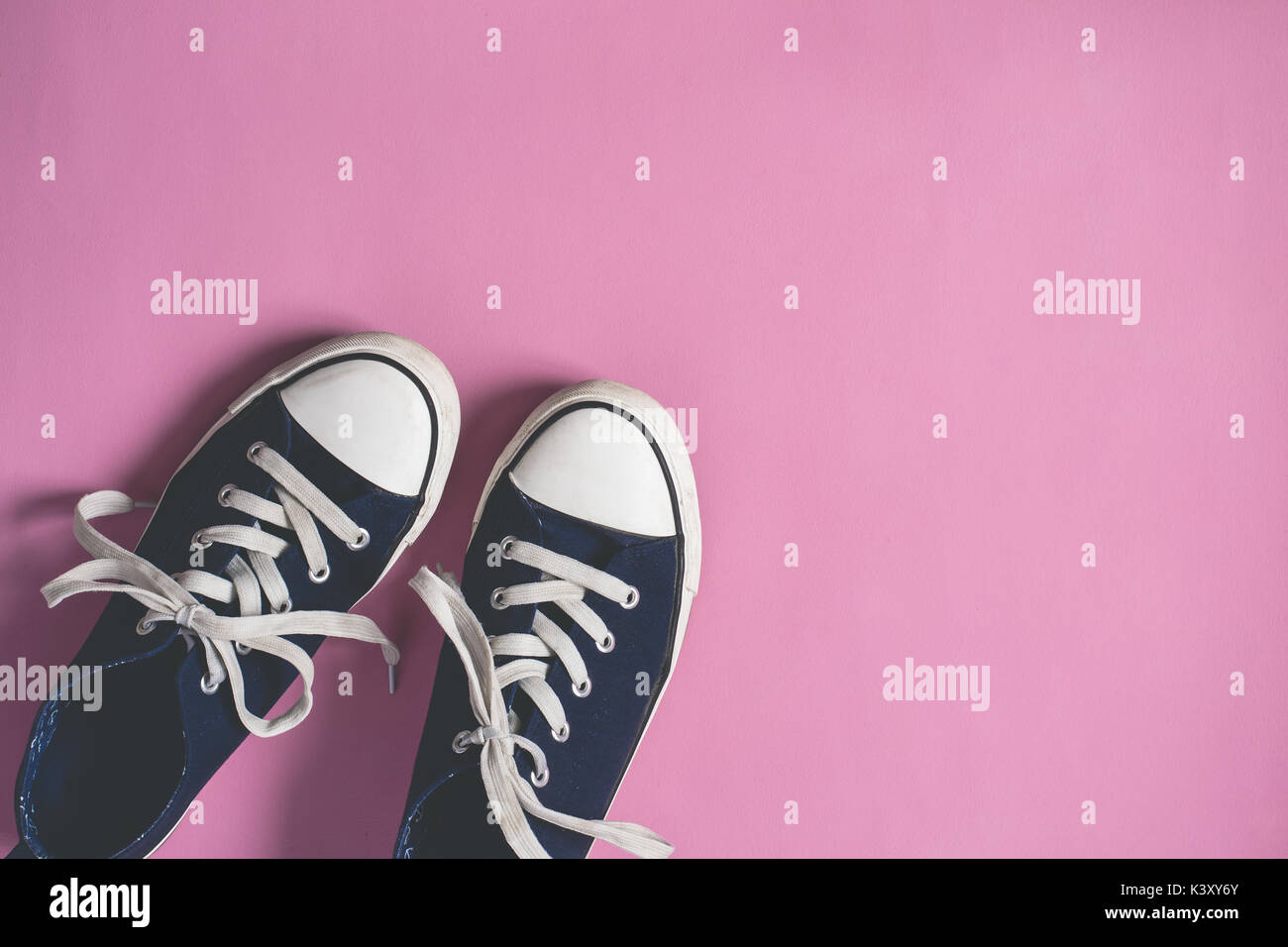 Dark blue Sneakers on pink pastel background flat lay copy space Stock ...