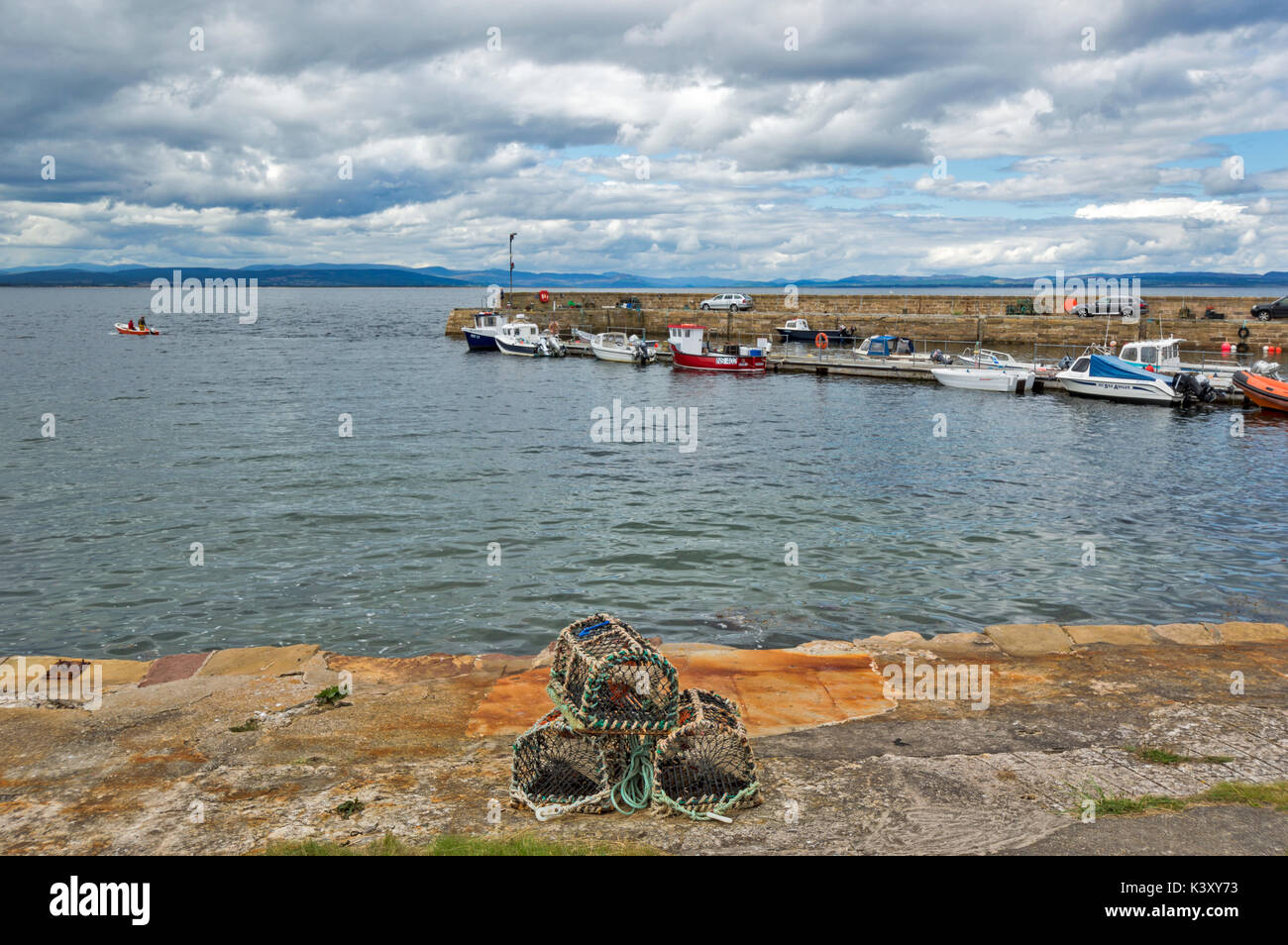 PORTMAHOMACK VILLAGE EASTER ROSS TARBAT PENINSULA THE HARBOUR AND JETTY WITH LOBSTER OR CRAB CREELS Stock Photo