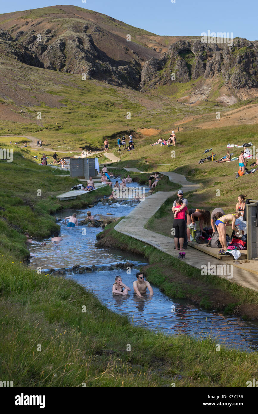 People enjoying the Reykjadalur hot spring river, Iceland, in summer