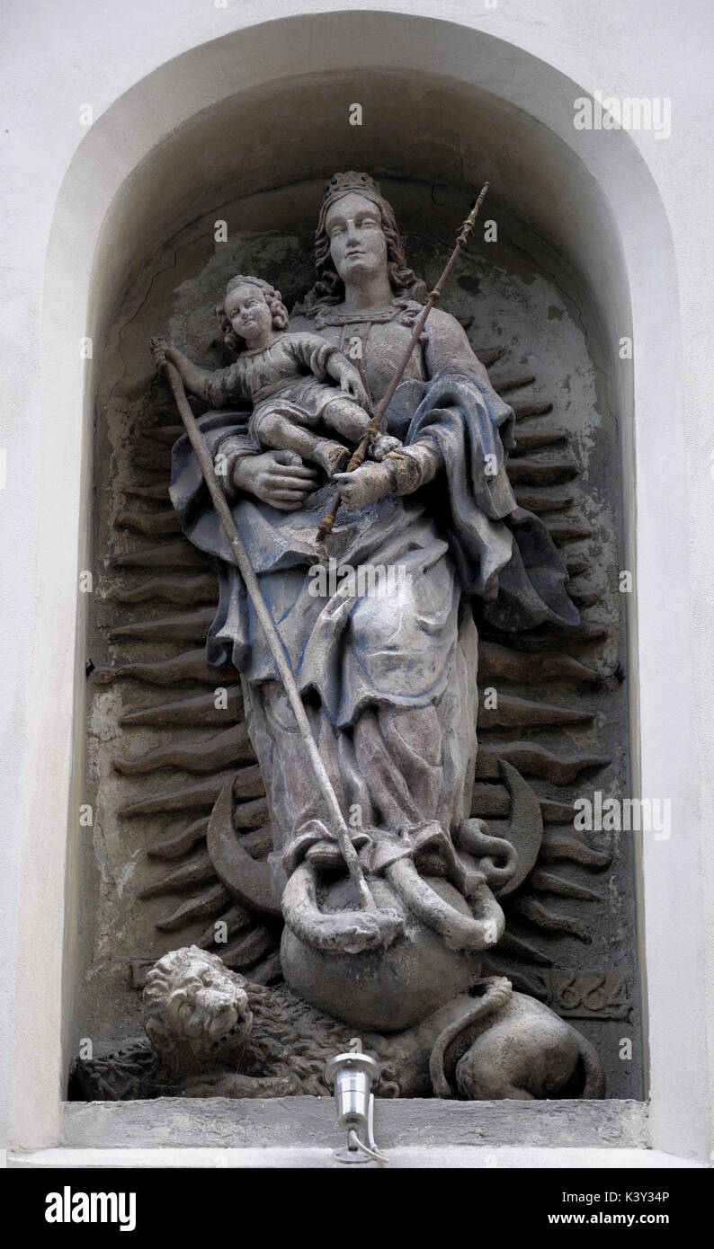 An ancient statue in the wall of the house Stock Photo - Alamy