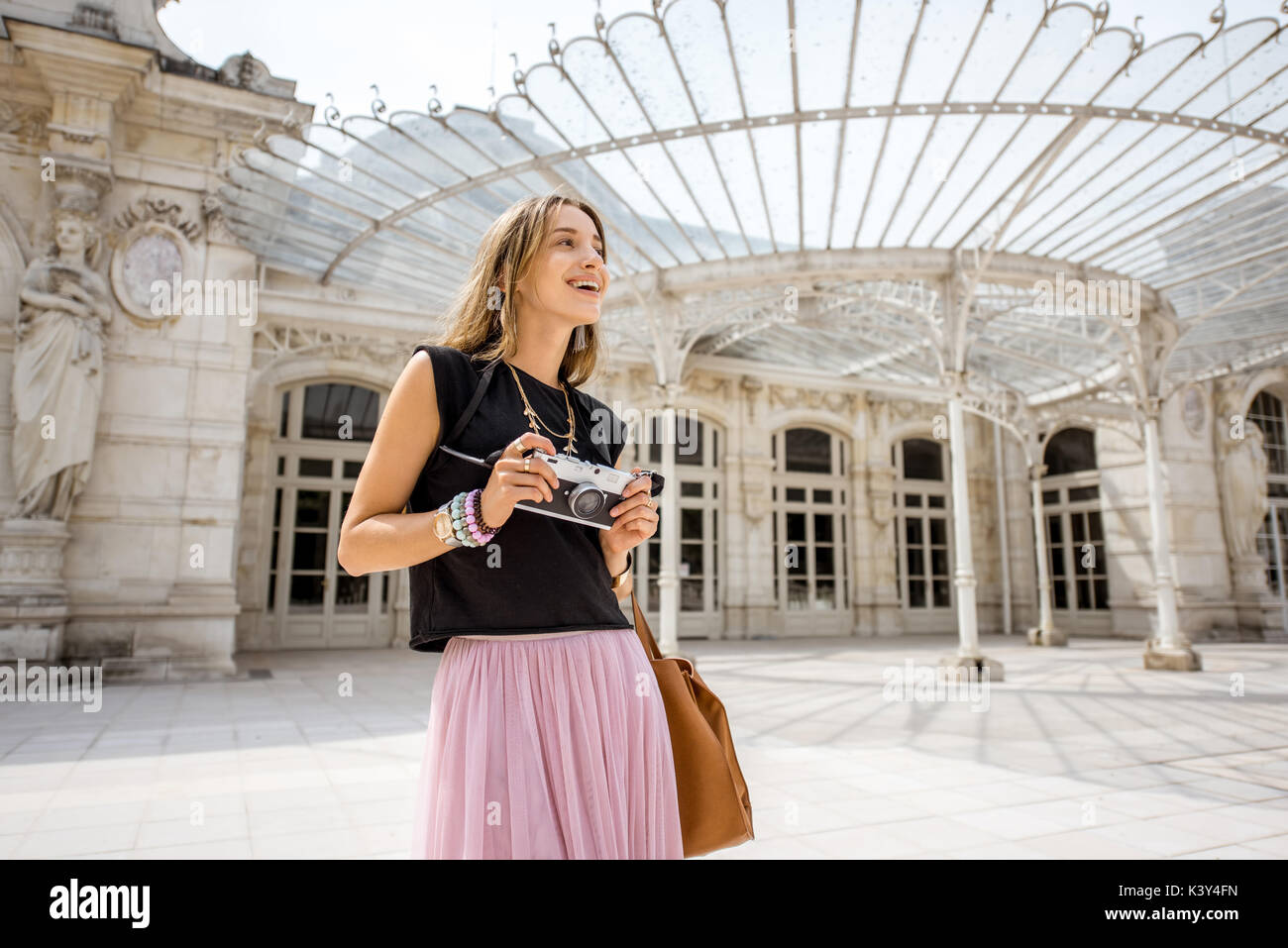 Woman near the old beautiful building in Vichy city, France Stock Photo