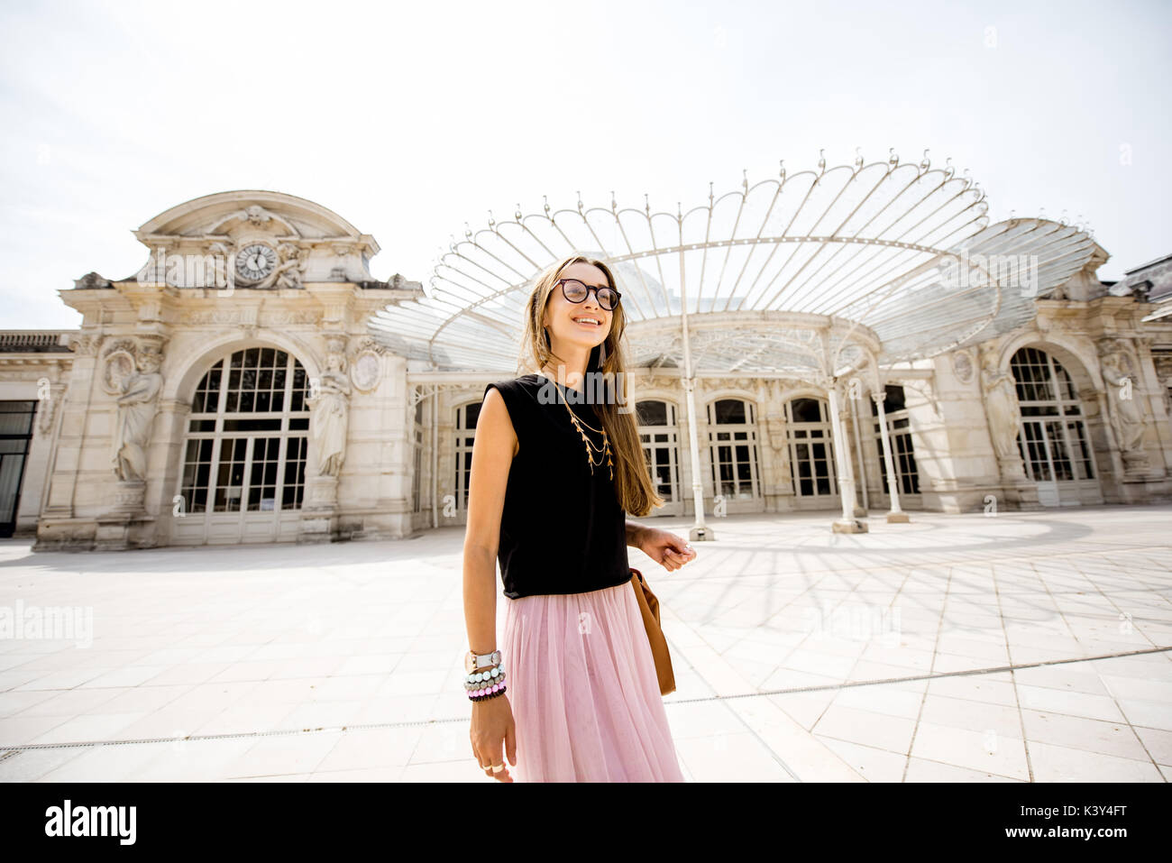Woman near the old beautiful building in Vichy city, France Stock Photo