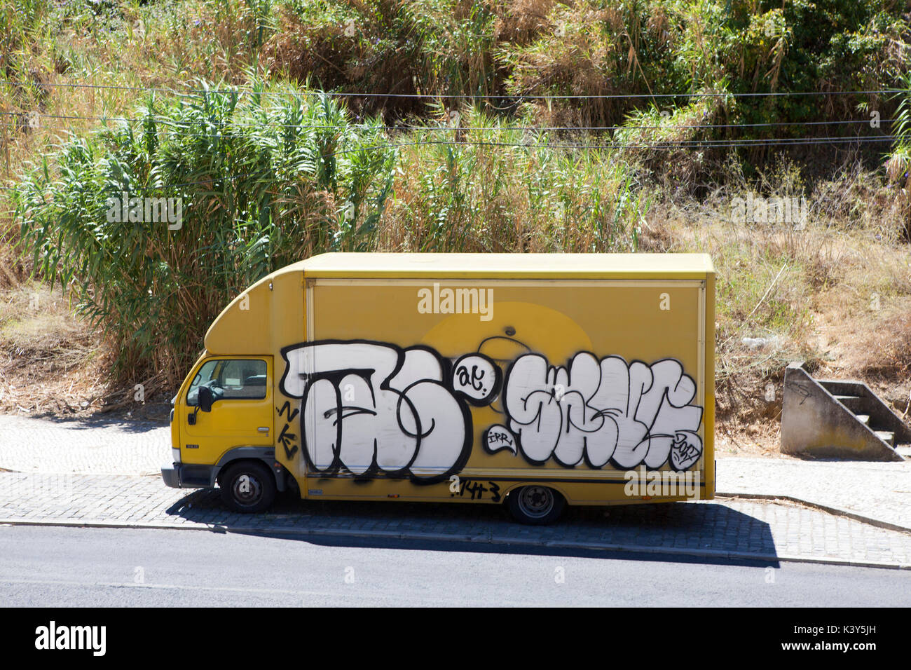 Lorry with graffiti in Lisbon, the capital and the largest city of Portugal in the Alfama District on the Atlantic coast in Western Europe Stock Photo