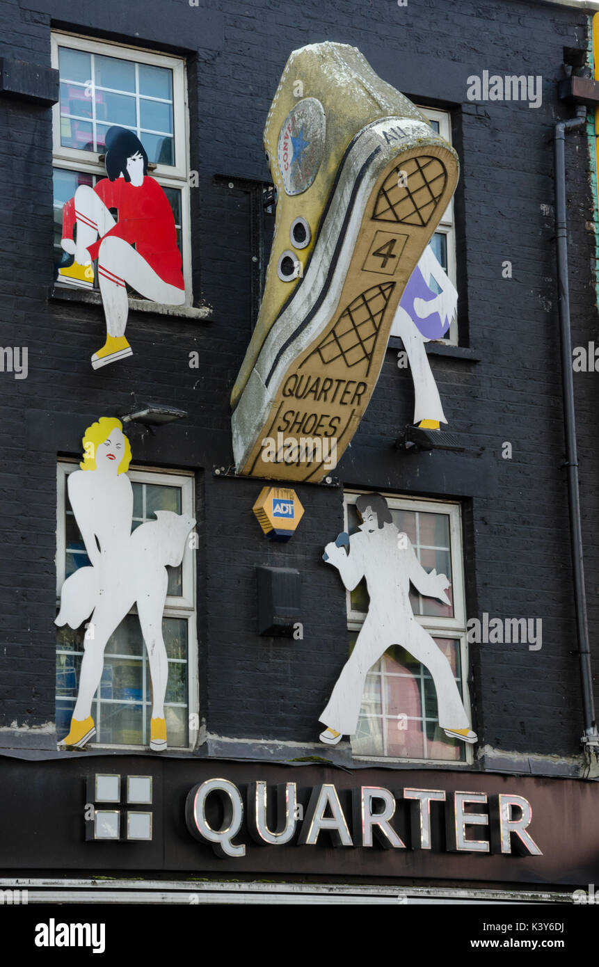 Artwork on the side of 'Quarter' shoe shop on Camden town High Street in London. Stock Photo