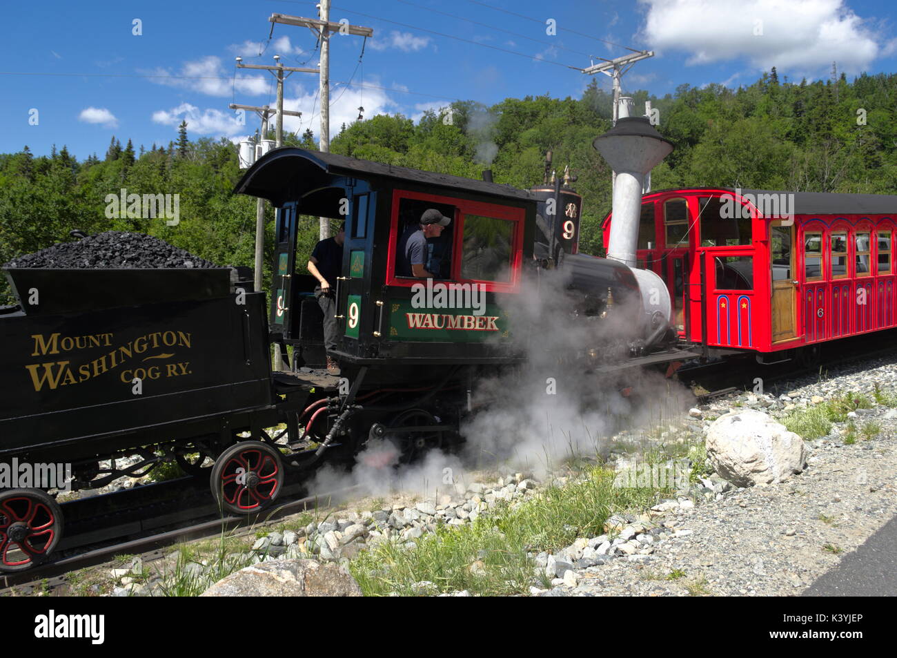 Steam Cog Mount Washington Cog Railroad on the way to the Summit, Mount Washington on a beautiful clear day. Visibility was 120 miles at the summit. Stock Photo