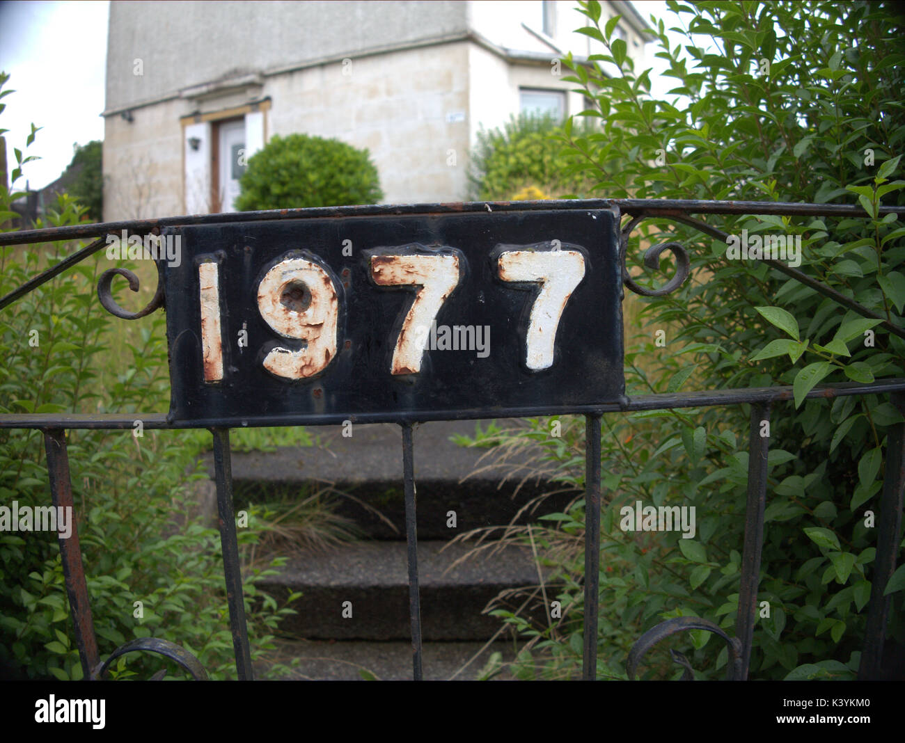 1977 door sign year reference in numbers digits Stock Photo