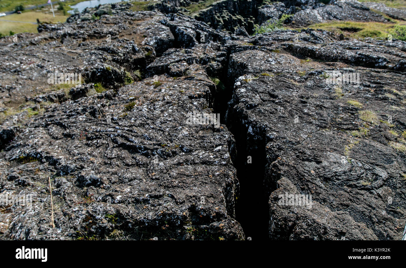 Pingvellir National Park - a crack in the lava rock. Stock Photo