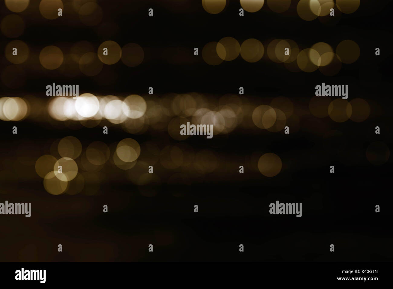 Bokeh golden circle with black background Stock Photo - Alamy