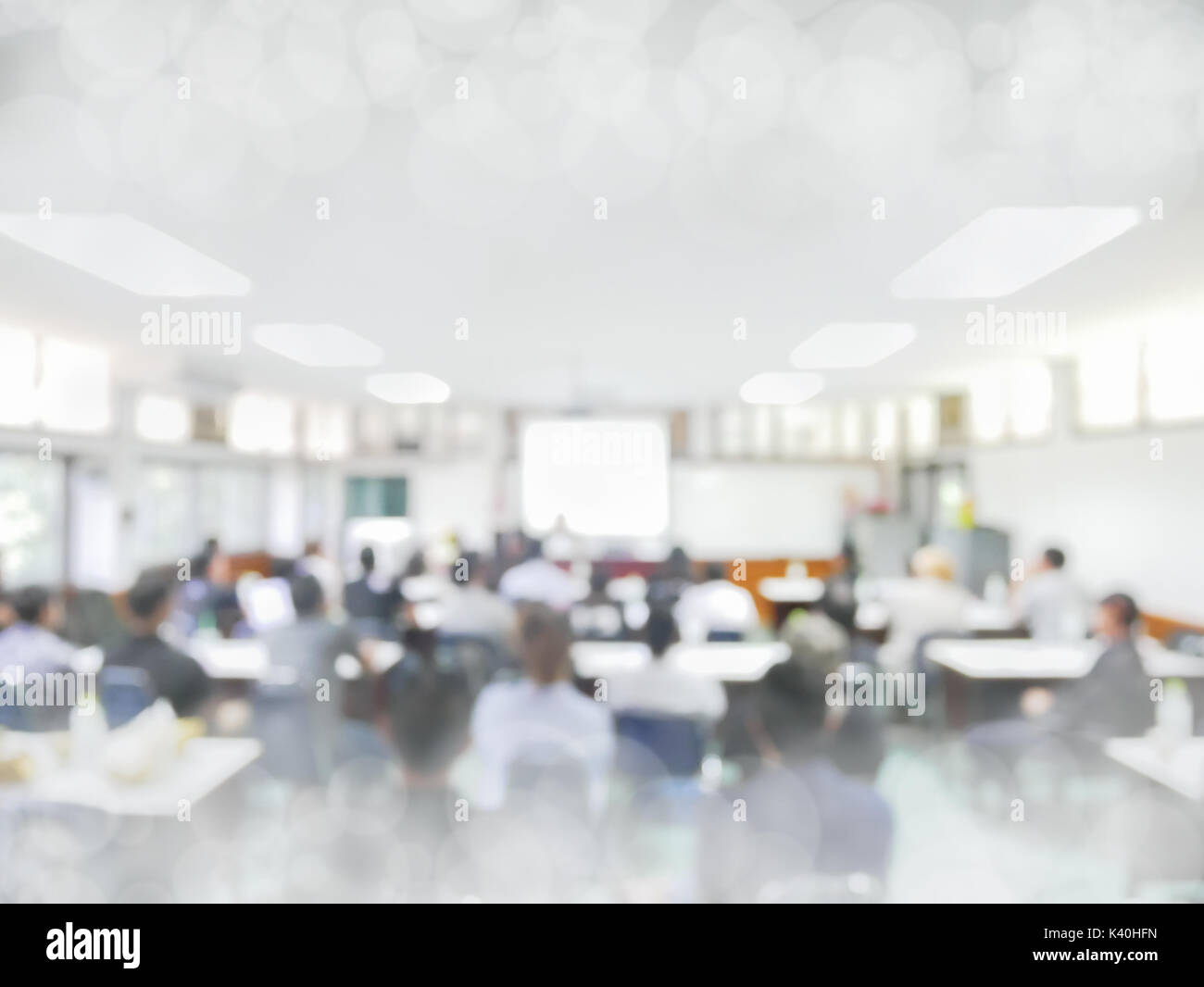 blurred people lecture in seminar room education or meetting concept ,abstract blur people background Stock Photo
