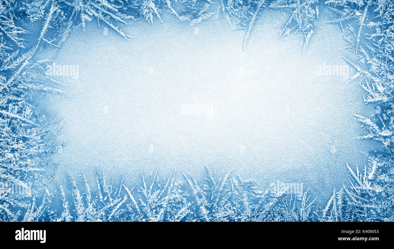 Frost crystal border on ice - Christmas background Stock Photo