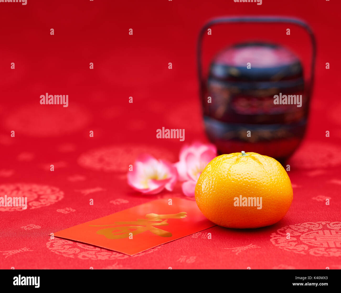 Chinese New Year - Mandarin orange and red packet (Foreign text means spring season) Stock Photo