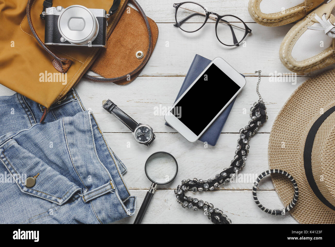 Top view accessoires to travel with women clothing concept. wallet on  wooden background.watch,bag,hat,notebook,camera,necklace and shoe on white  wood Stock Photo - Alamy