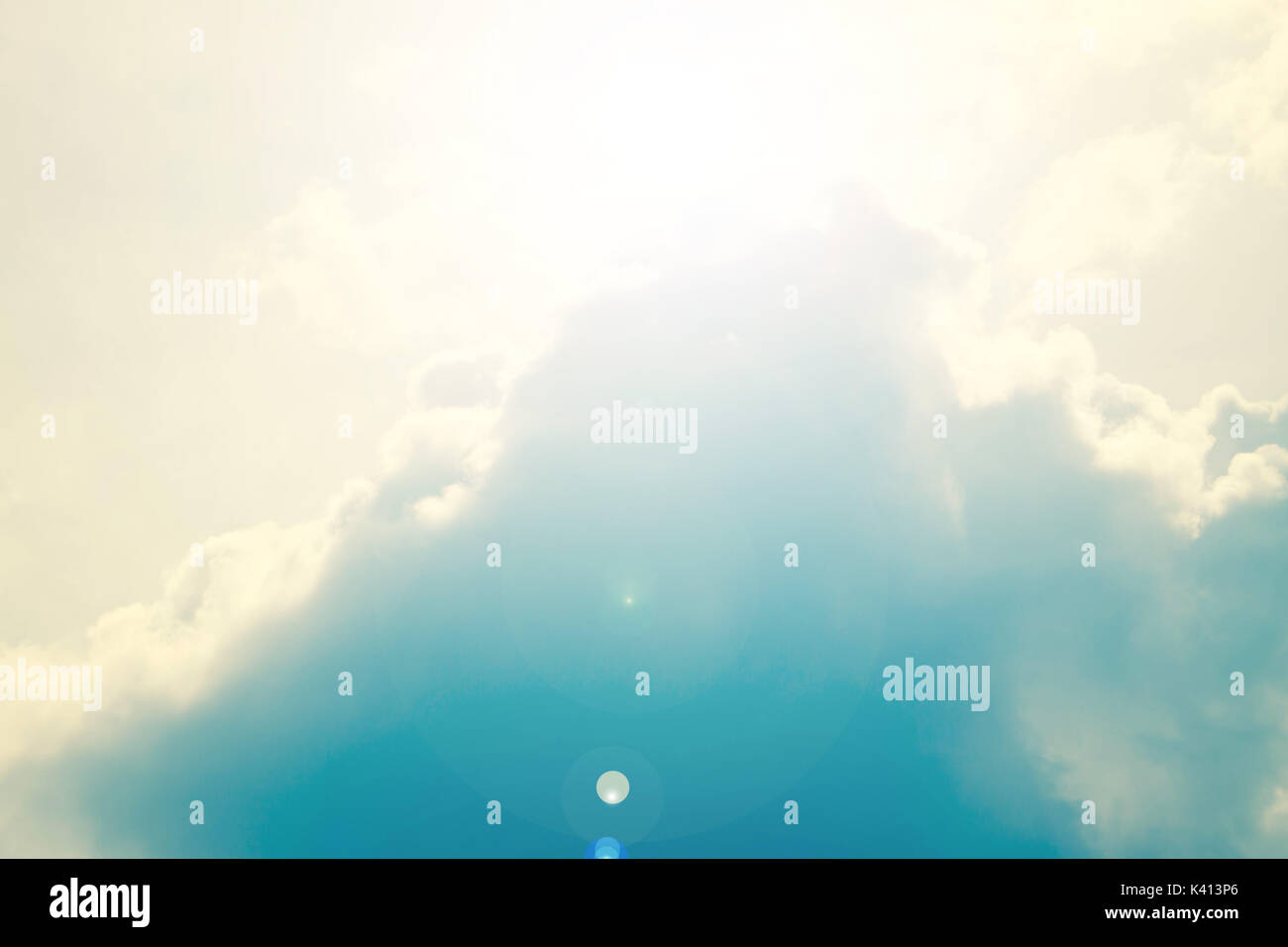 Clouds and the sun against the dark blue sky Stock Photo - Alamy