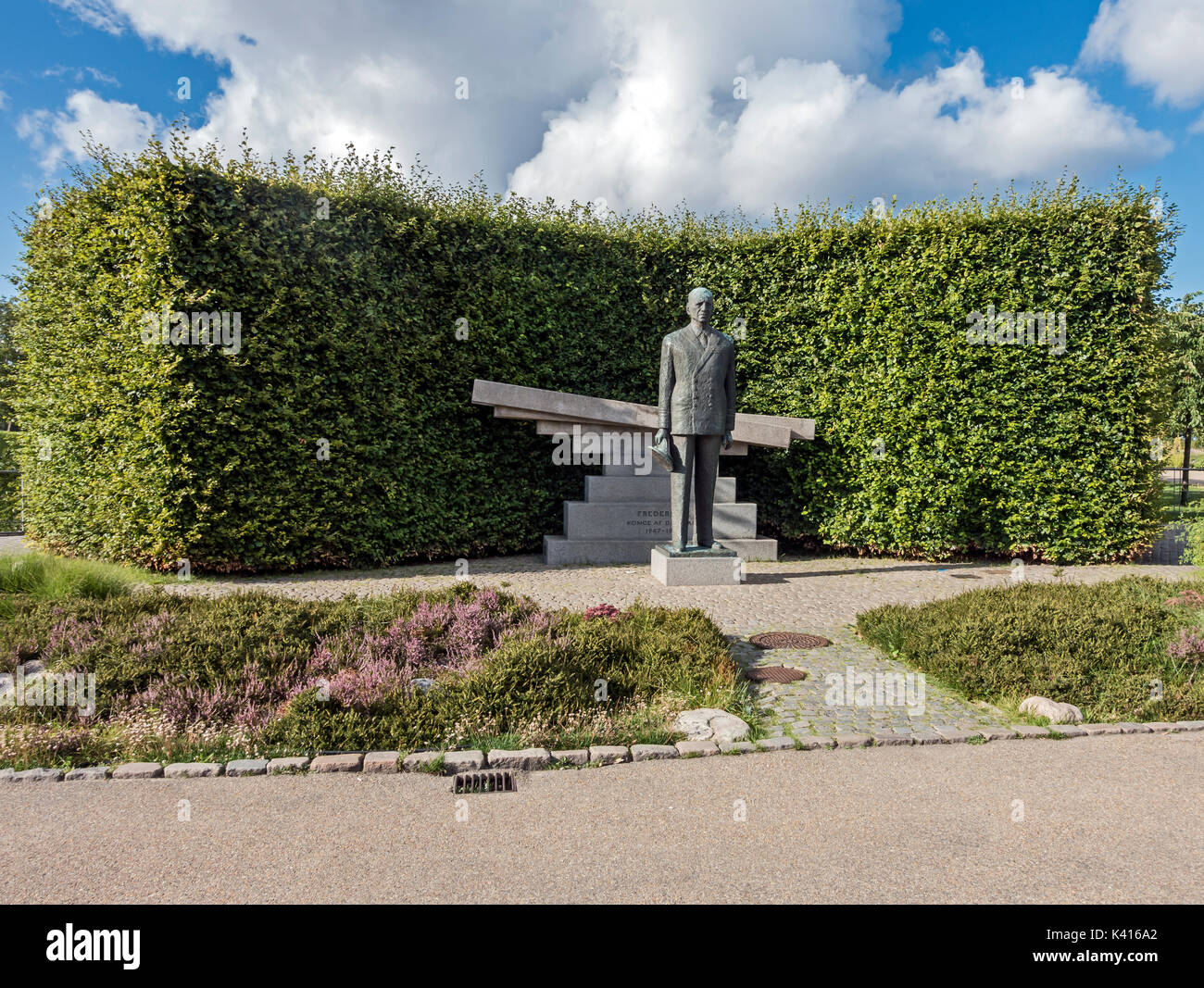 Bronze statue of Danish king Frederik IX with granite monument at Nordre Toldbod in Copenhagen Denmark Europe Stock Photo