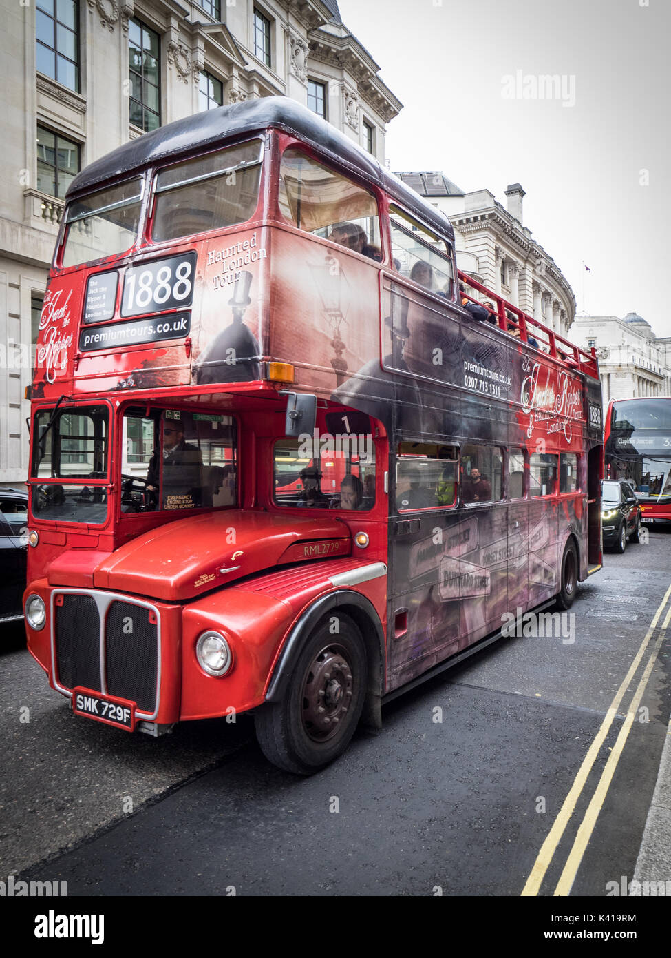 London Tourism - Jack the Ripper open topped tour bus in the City of London financial district Stock Photo