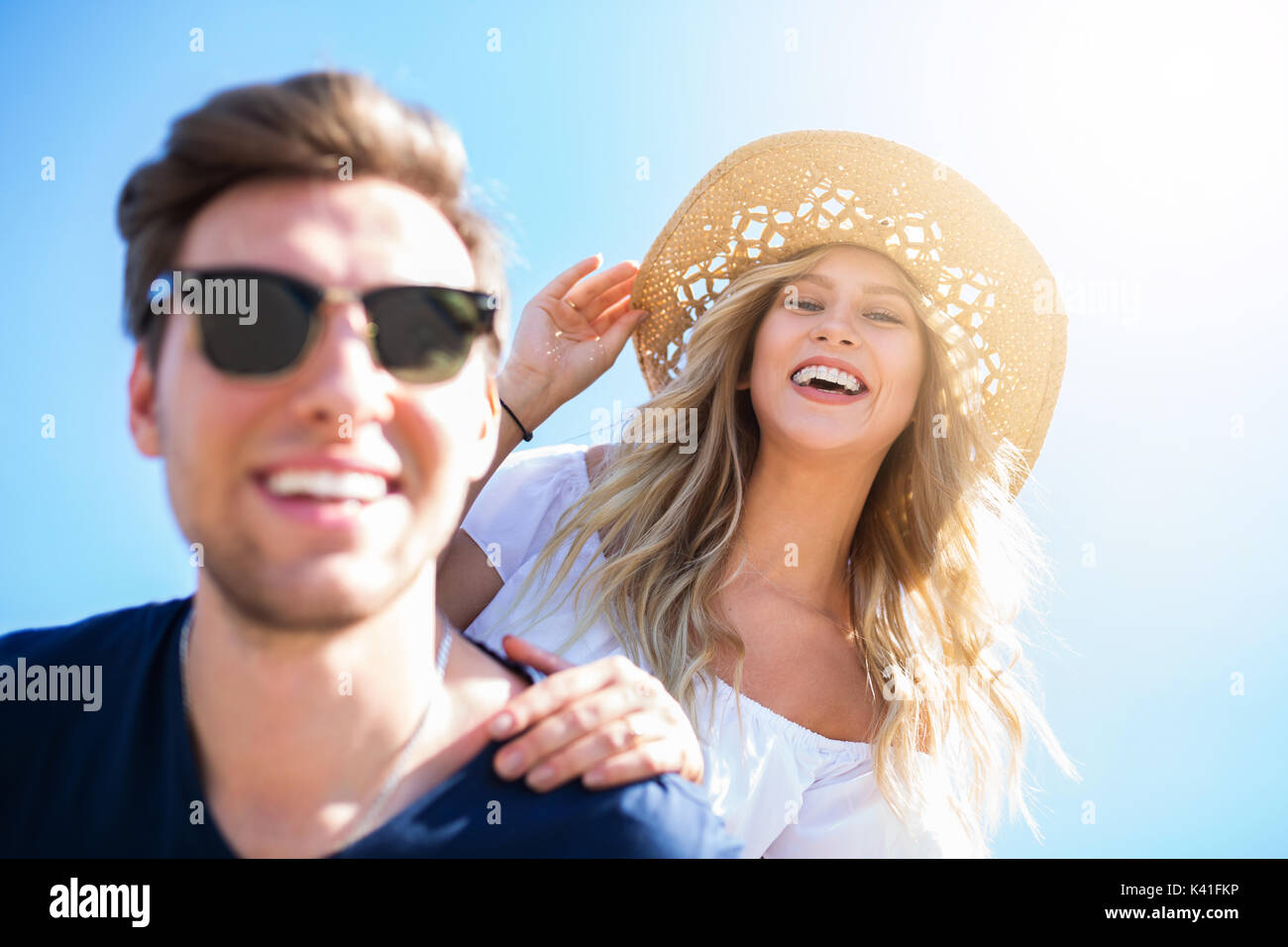 A photo of young, happy couple having fun on holiday Stock Photo - Alamy