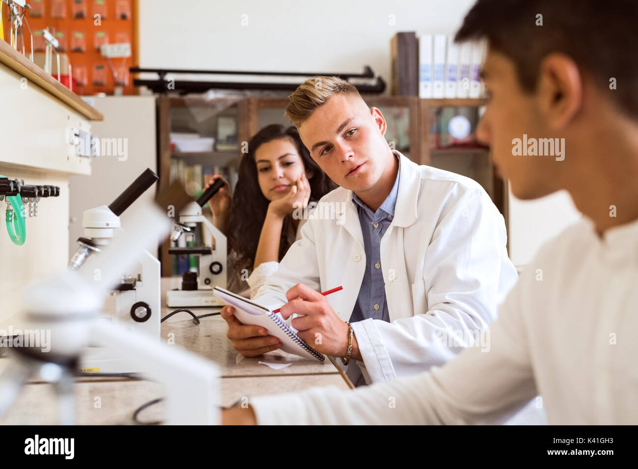 High school student with microscopes in laboratory Stock Photo Alamy