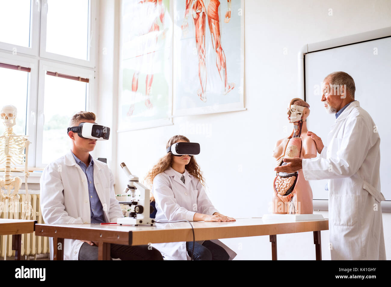 Senior teacher teaching biology to high school students Stock Photo - Alamy