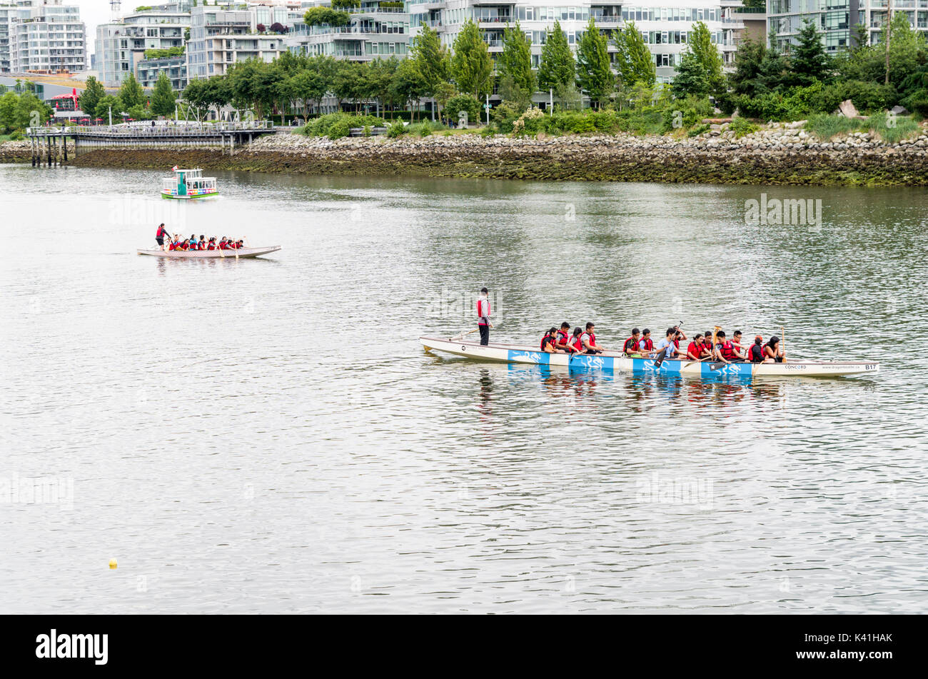 Vancouver, British Columbia Canada, June 14, 2017:Dragon boats crews out rowing on False Creek Stock Photo