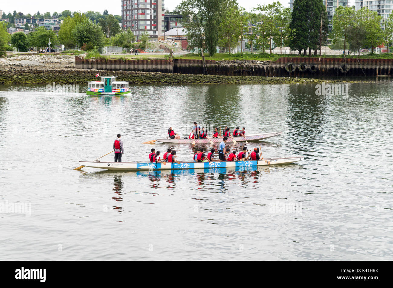 Vancouver, British Columbia Canada, June 14, 2017: Dragon boats crews out rowing on False Creek Stock Photo