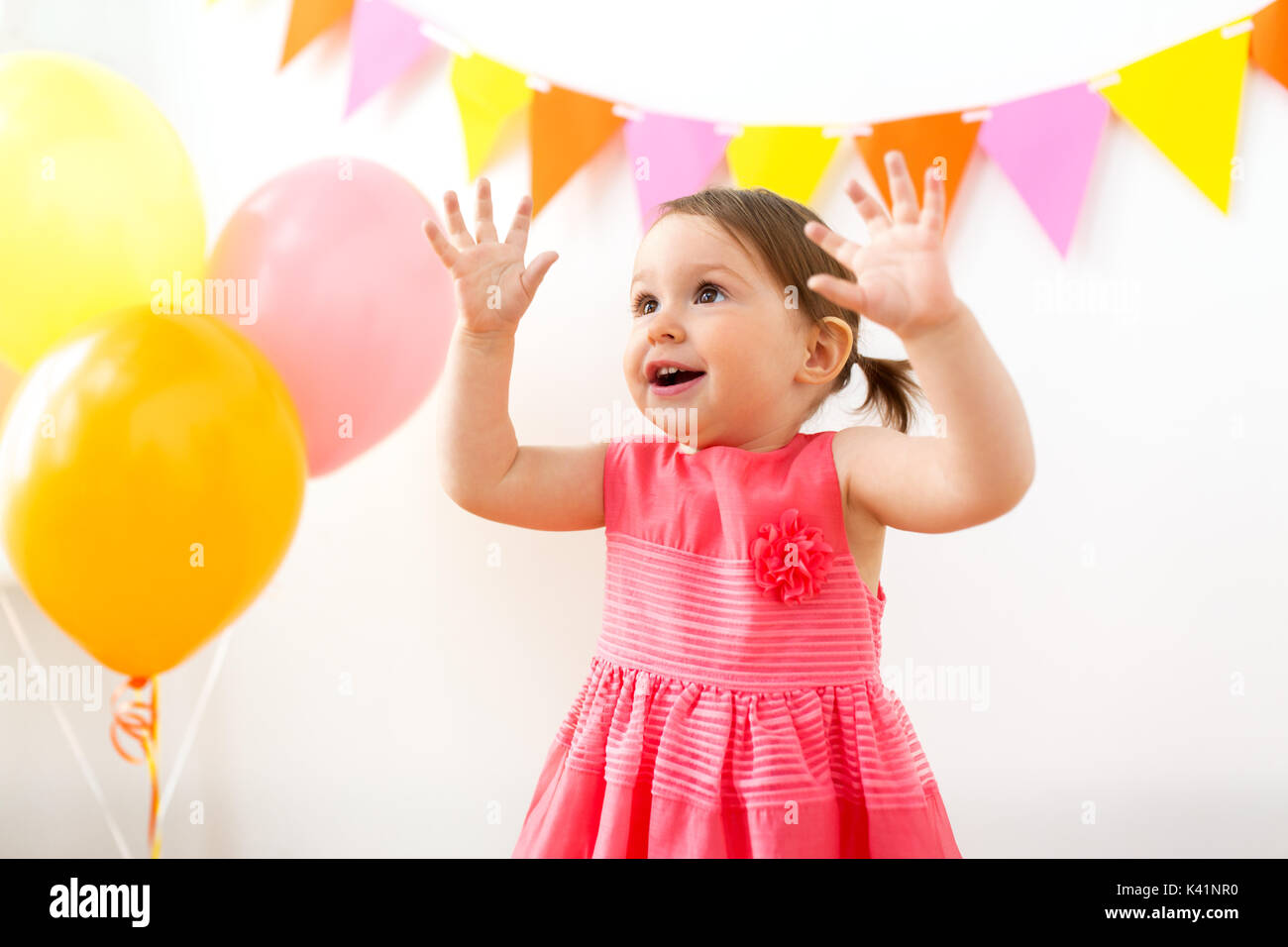 happy baby girl on birthday party Stock Photo - Alamy