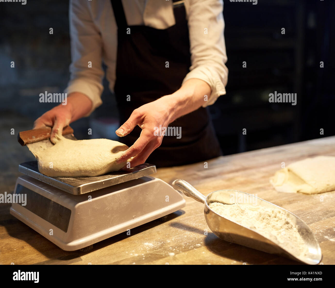 Baker Weighing Dough On Kitchen Scale Stock Photo 1646504854