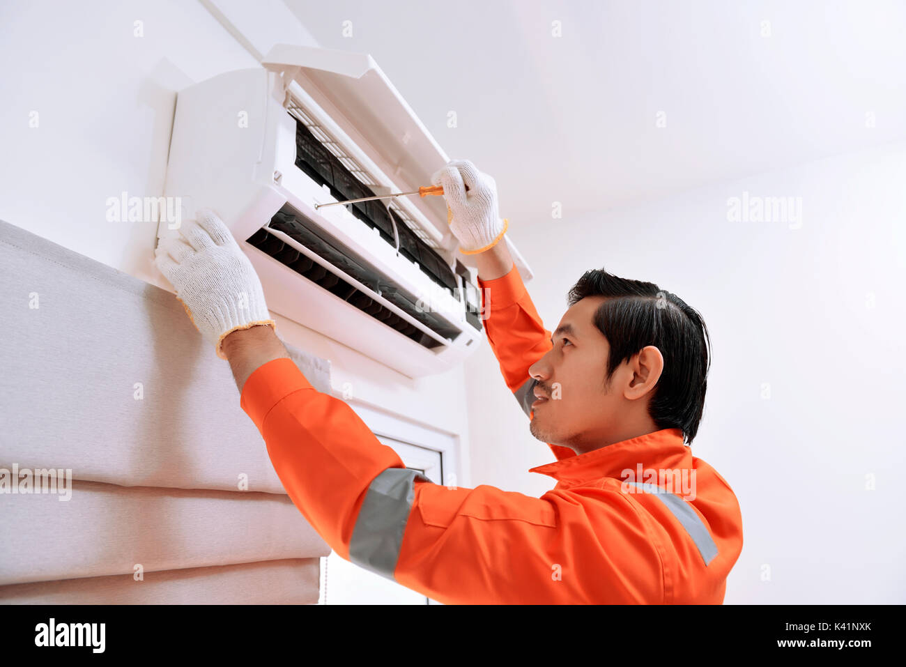 Asian male technician hi-res stock photography and images - Alamy