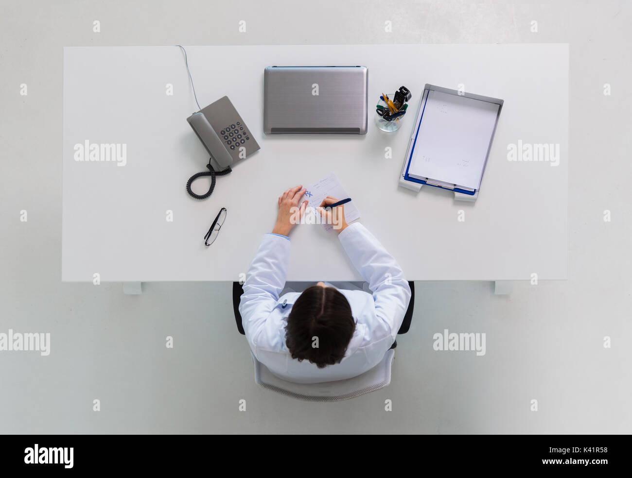 Therapist writing prescription medical hi-res stock photography and ...