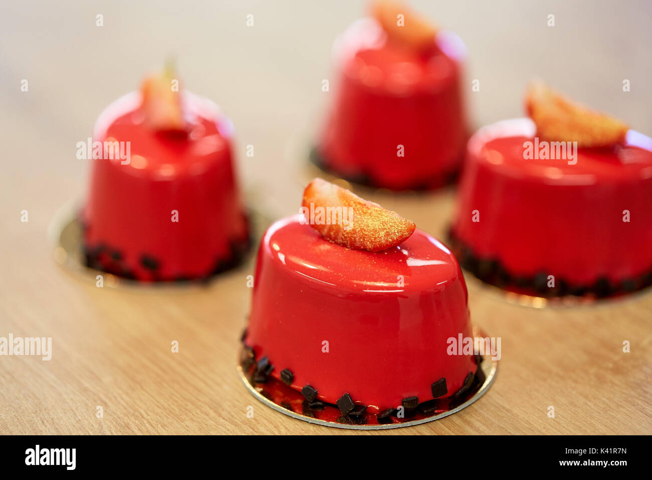 strawberry mirror glaze cakes at confectionery Stock Photo