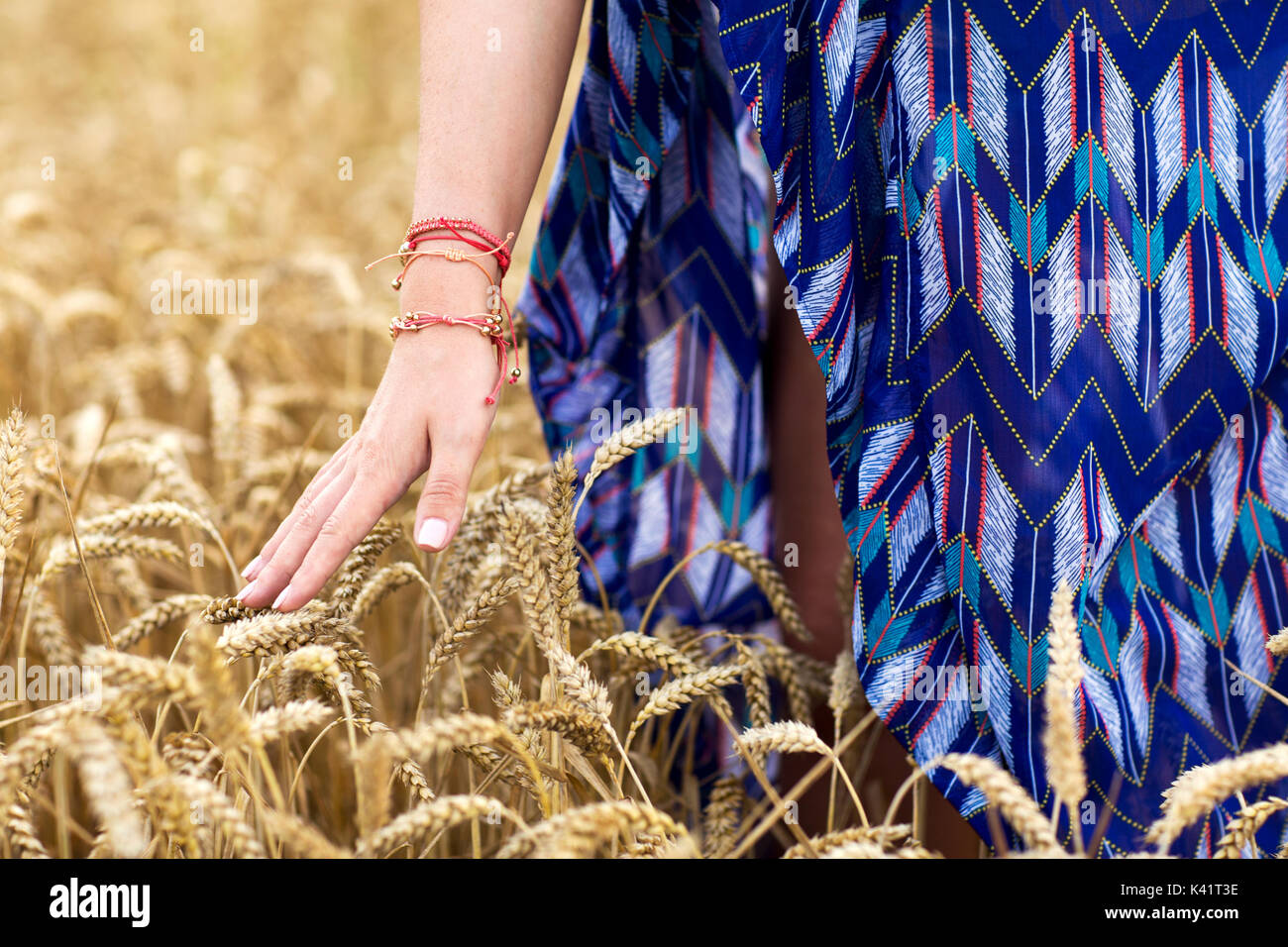 close up of young hippie woman on cereal field Stock Photo