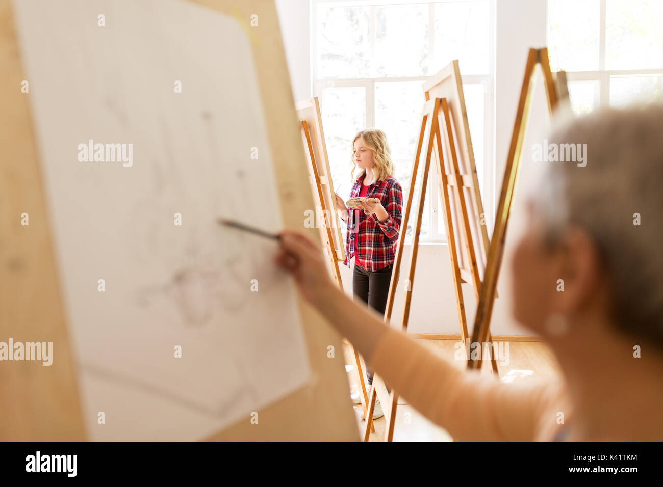 student girl with easel painting at art school Stock Photo - Alamy