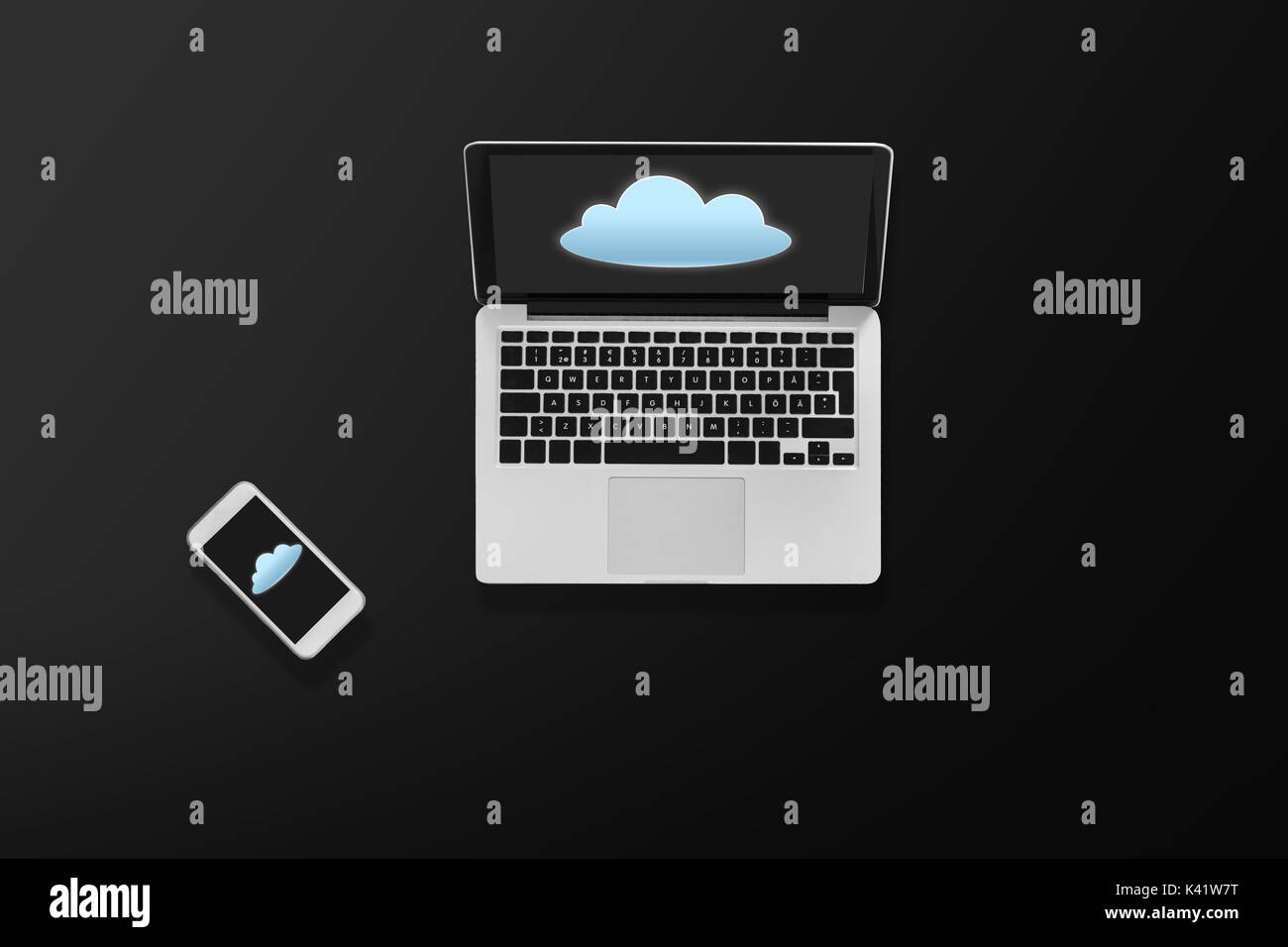 laptop computer with cloud icon and smartphone Stock Photo