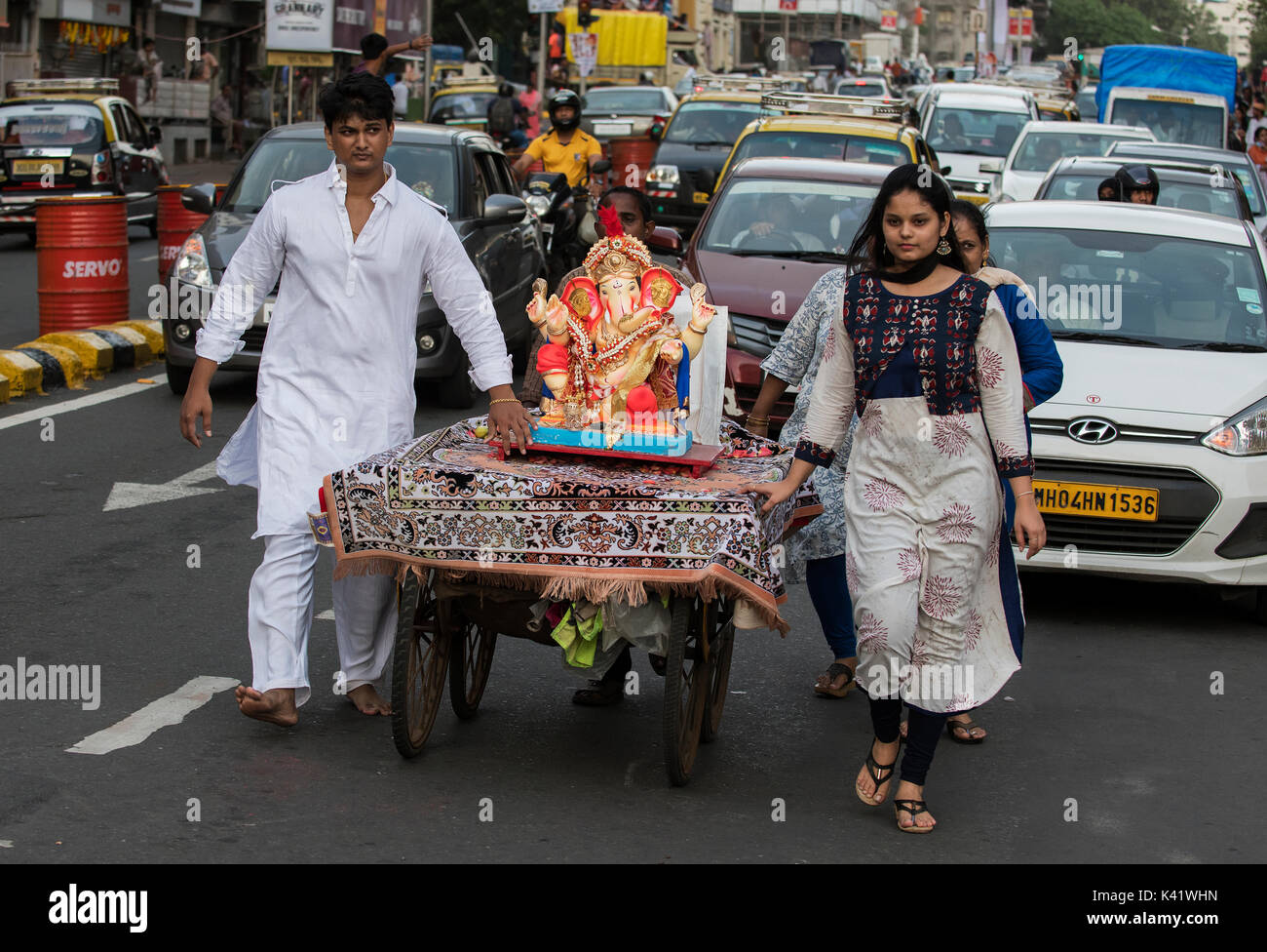 The image of Ganpati or Elephant headed lord in Taxi on the way to immersion at Giraguam Chowpatty.Mumbai, India Stock Photo