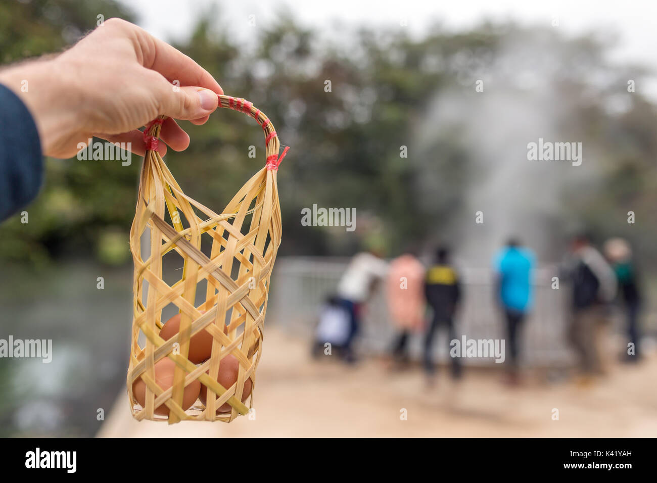 Basket with fresh eggs ready to be cooked in hot springs near Chiang Mai, Northern Thailand Stock Photo
