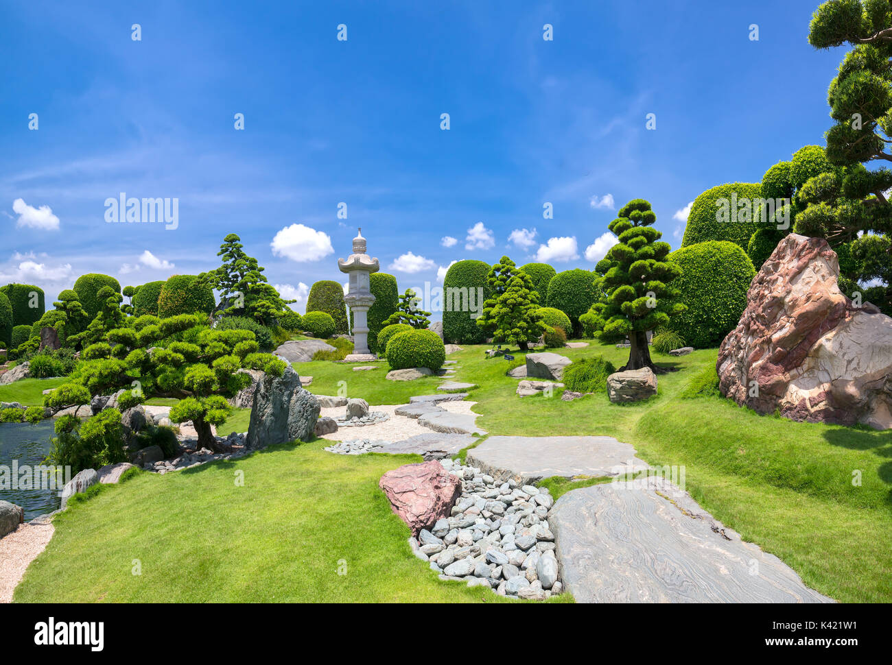 Beautiful garden in ecotourism is designed harmony with cypress, pine, stone and ancient trees bearing traditional culture of traditional Japanese Stock Photo