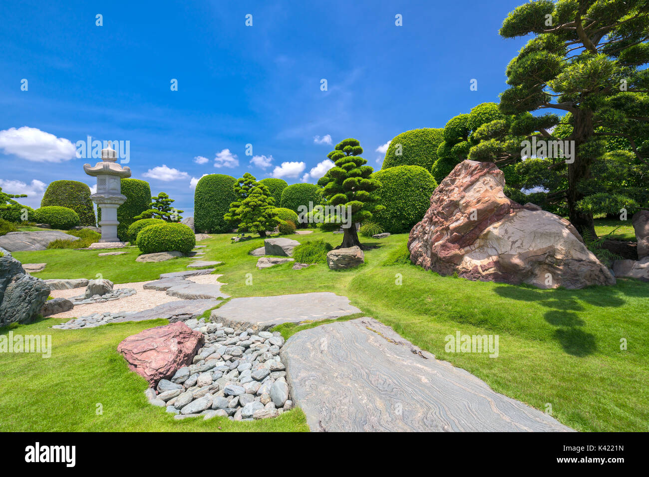 Beautiful garden in ecotourism is designed harmony with cypress, pine, stone and ancient trees bearing traditional culture of traditional Japanese Stock Photo