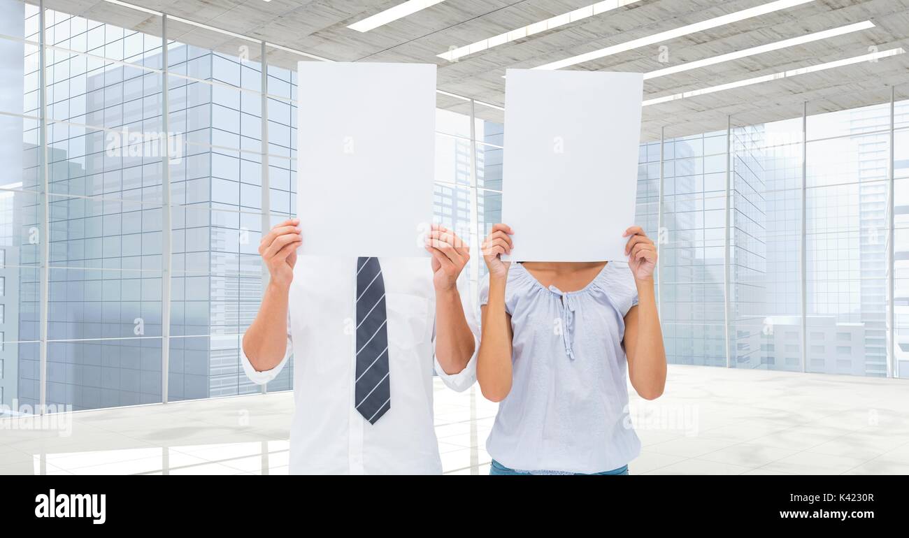 Digital composite of Business people holding blank card in office Stock Photo