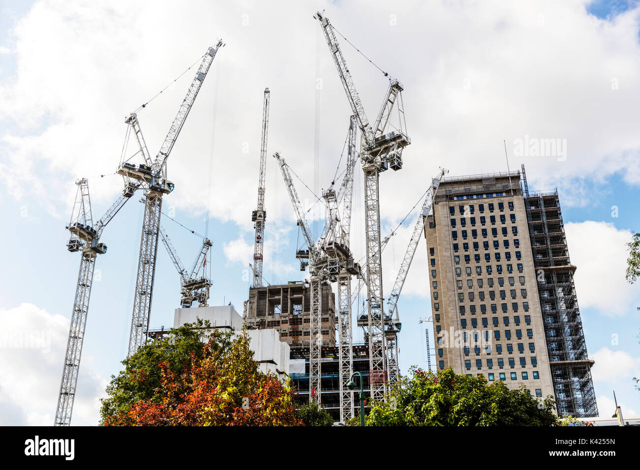 Tower cranes, building work, construction, cranes, tower crane, London construction, Construction UK, London flats, working at heights, London, UK, Stock Photo