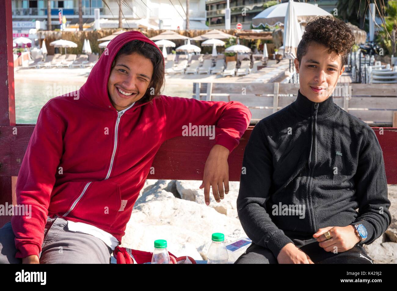 Two young French men of Algerian descent pose for a picture in Juan les Pins, Cote d'Azur, France. France has large MAGHRE population Stock Photo